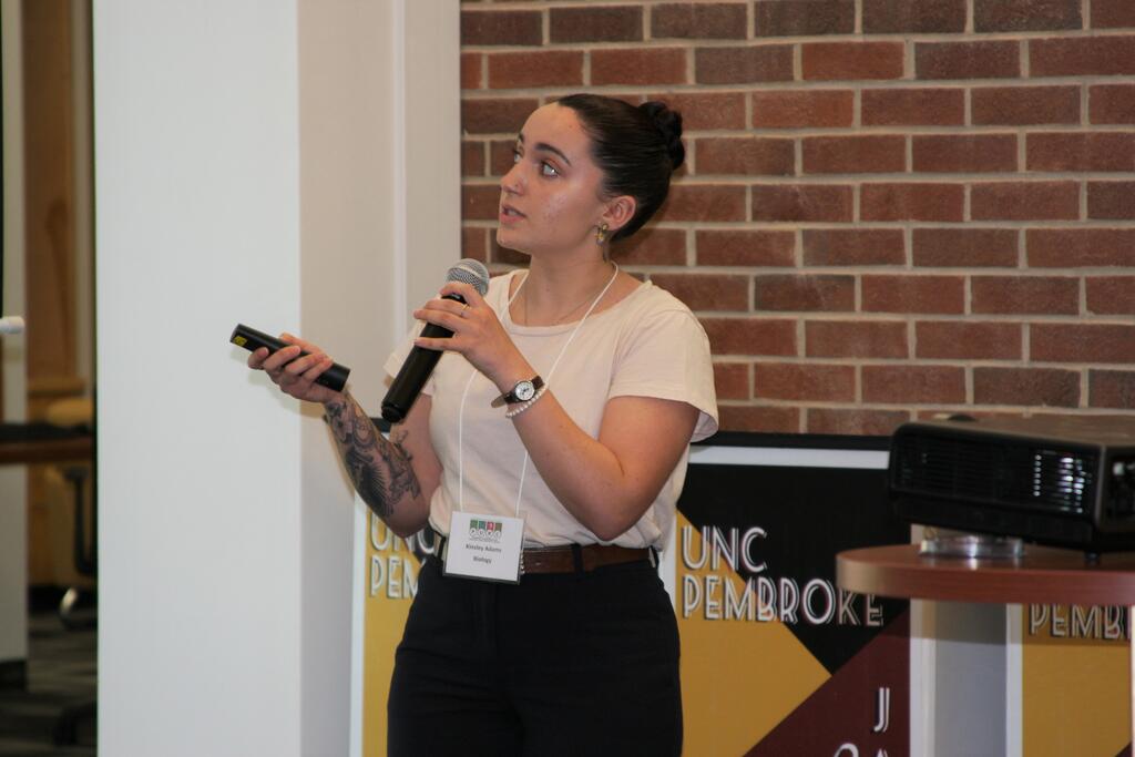 Kinsley Adams gives presentation during 2023 PURC Symposium