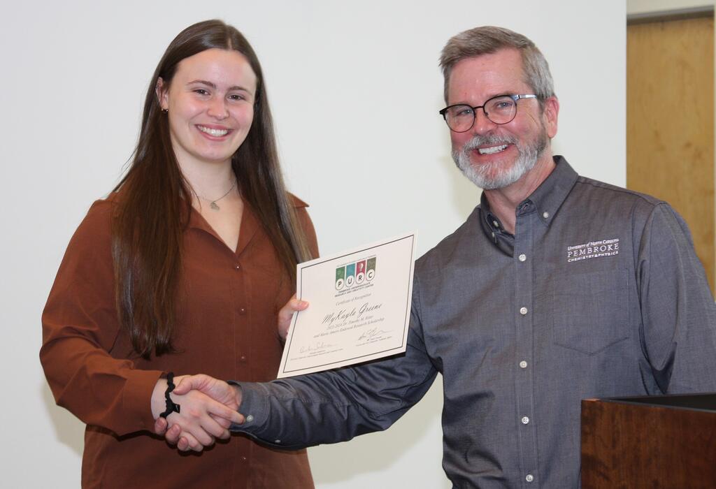 MyKayla Greene (left) and Dr. Paul Flowers during the 2024 PURC Symposium