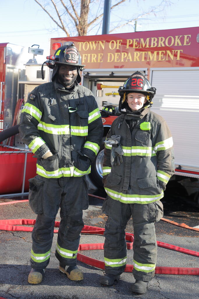 UNCP graduate students Trenton Brown, left, Anna Grossheim double as volunteer firefighters in Robeson County