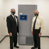 Bill Smith and Chancellor Cummings with freezer at RCHD