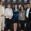 Award winners stand as a group at a ceremony at UNCP. 